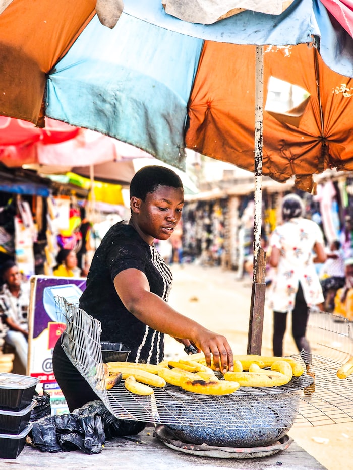 Market trader preparing food at her stall